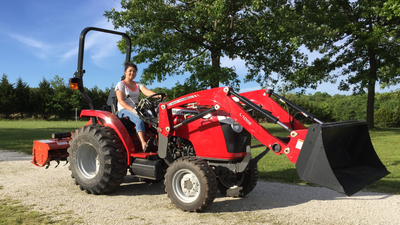 Attached picture May 17 Shannon on new tractor.PNG
